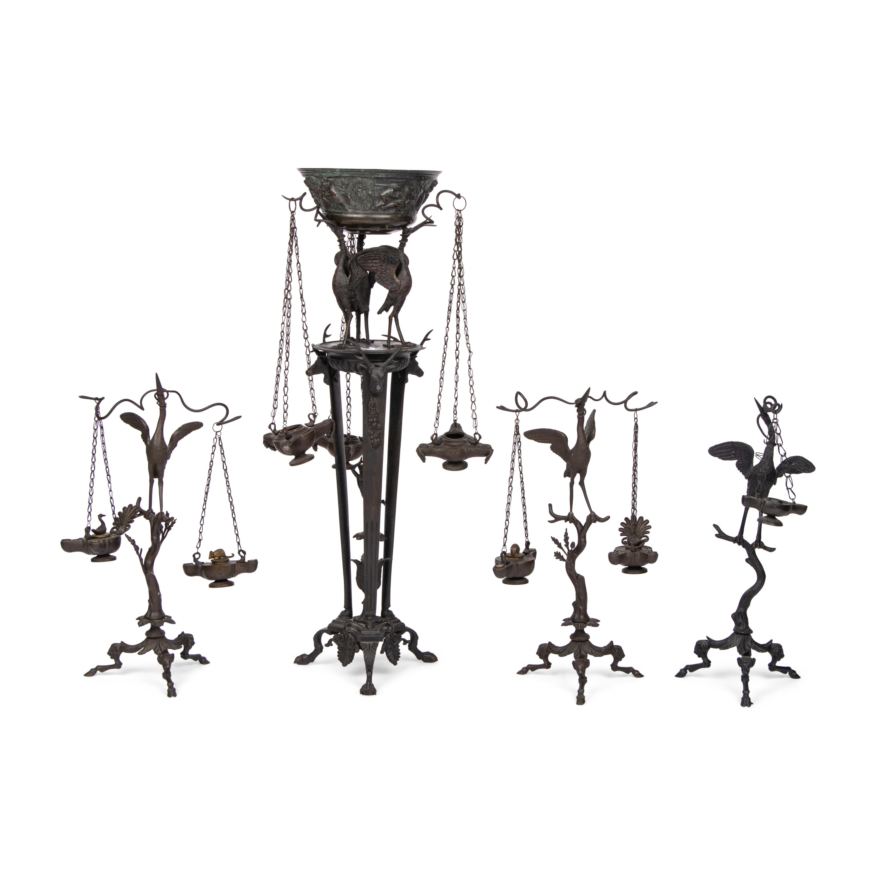 A Grand Tour Bronze Three-Piece Oil-Lamp Garniture