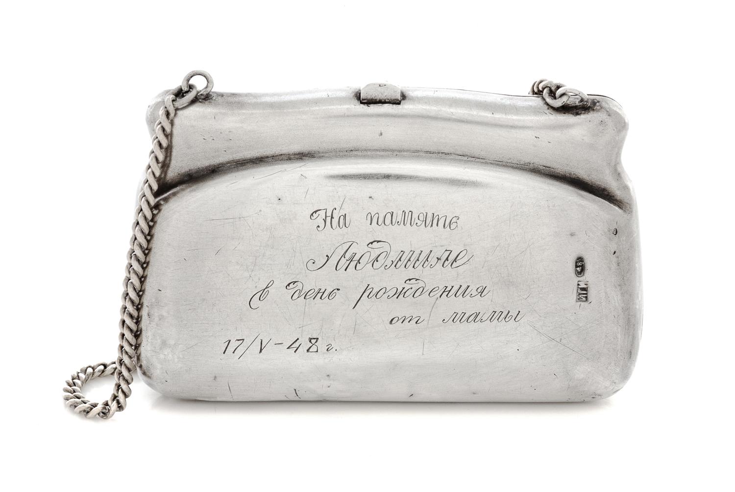 A Russian Silver Change Purse, Maker's mark Cyrillic IGI, Moscow, early 20th century, the front centered by an engraved cabin in a fore