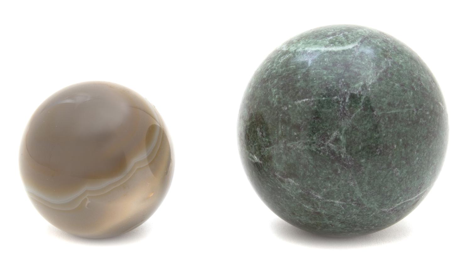 Two Round Hardstones Spheres Diameter of largest 3 inches. — 20TH CENTURY