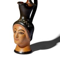 A Greek Painted Terracotta Figural Oinochoe