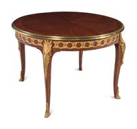 A Louis XVI Style Gilt Bronze Mounted Parquetry Dining Table