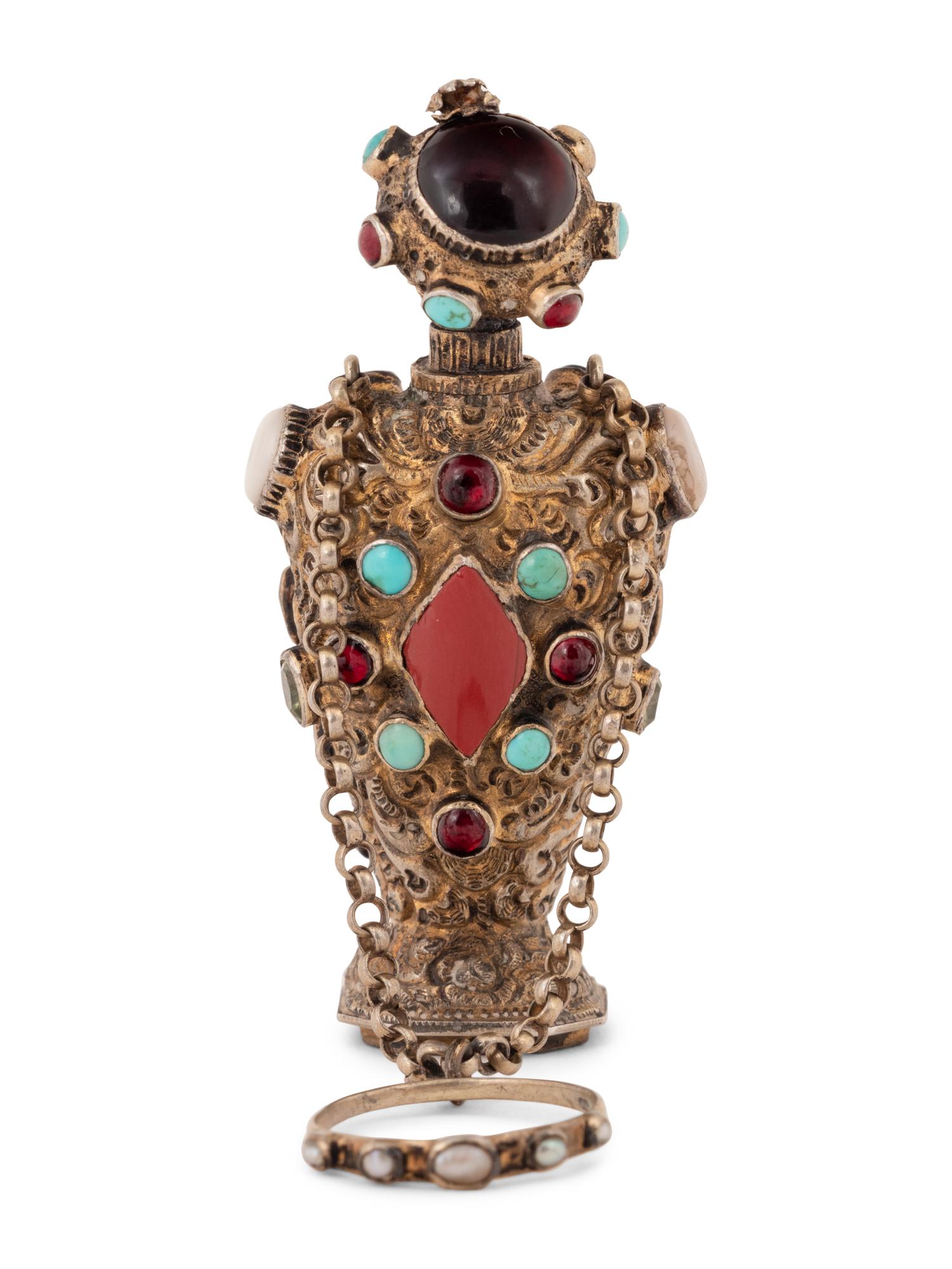 A Continental Jeweled Silver Figural Scent Bottle and Hand Seal