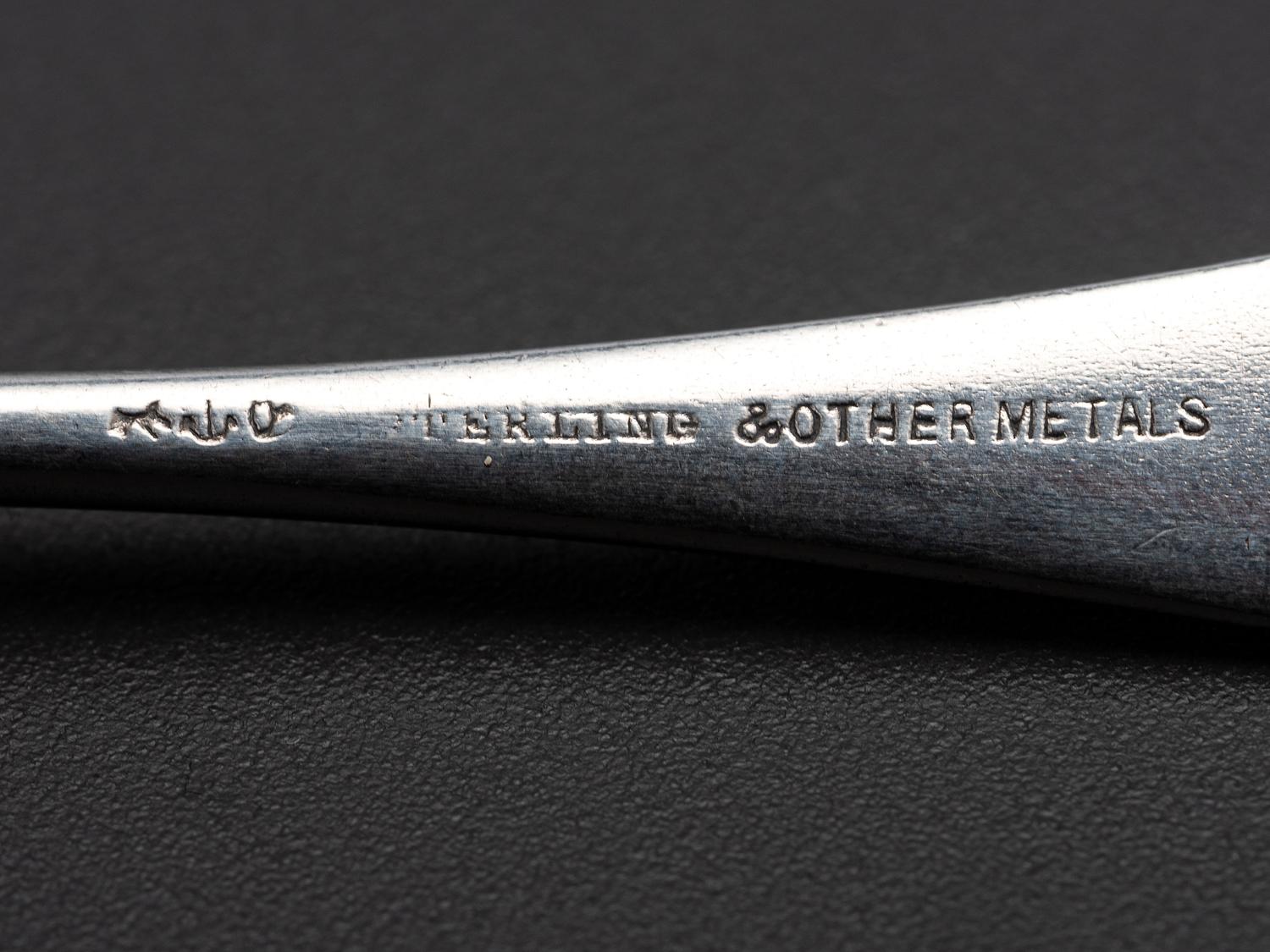 Eight American Silver and Mixed Metal Demitasse Spoons