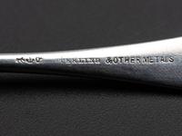 Eight American Silver and Mixed Metal Demitasse Spoons