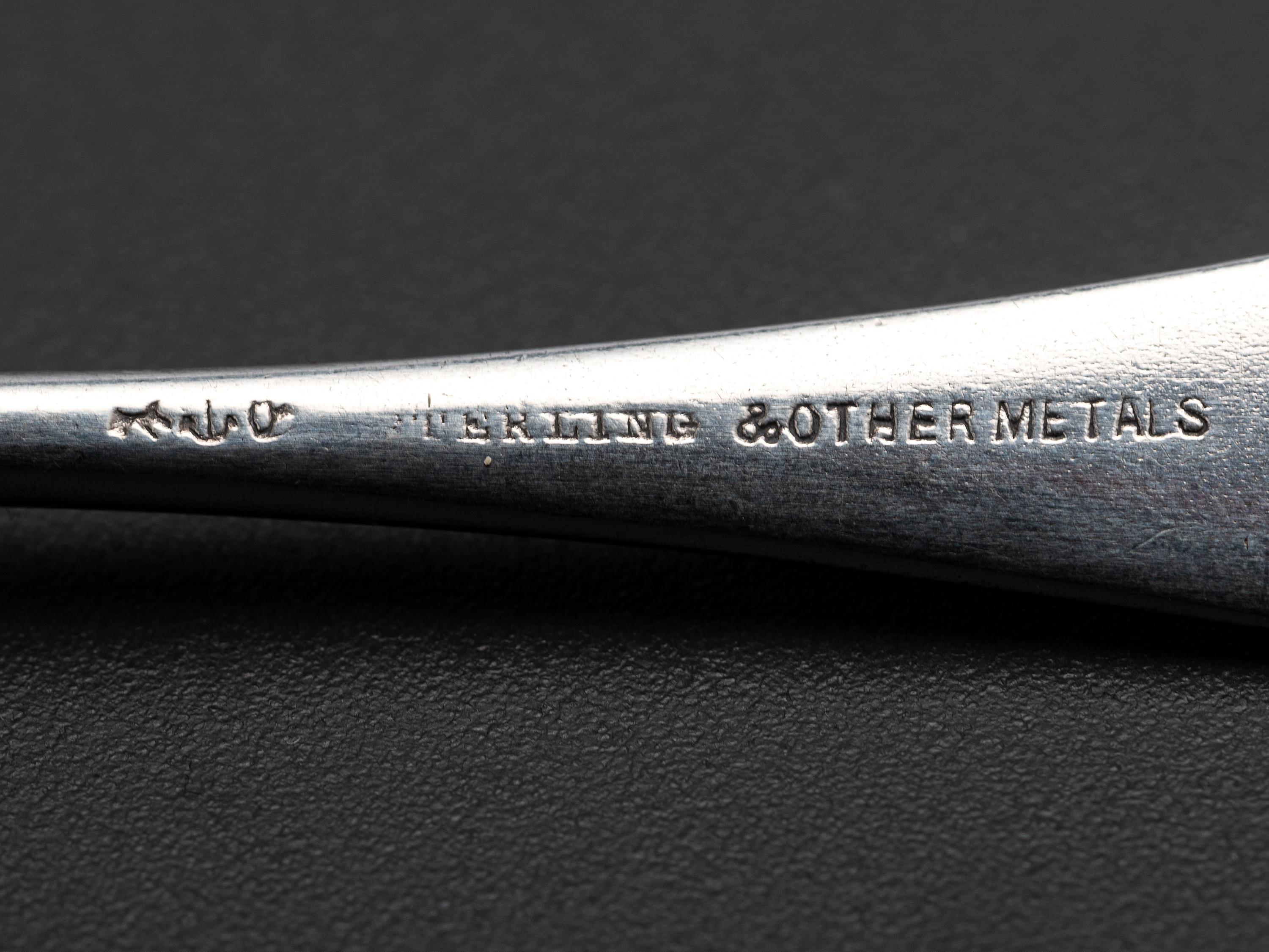 Eight American Silver and Mixed Metal Demitasse Spoons
