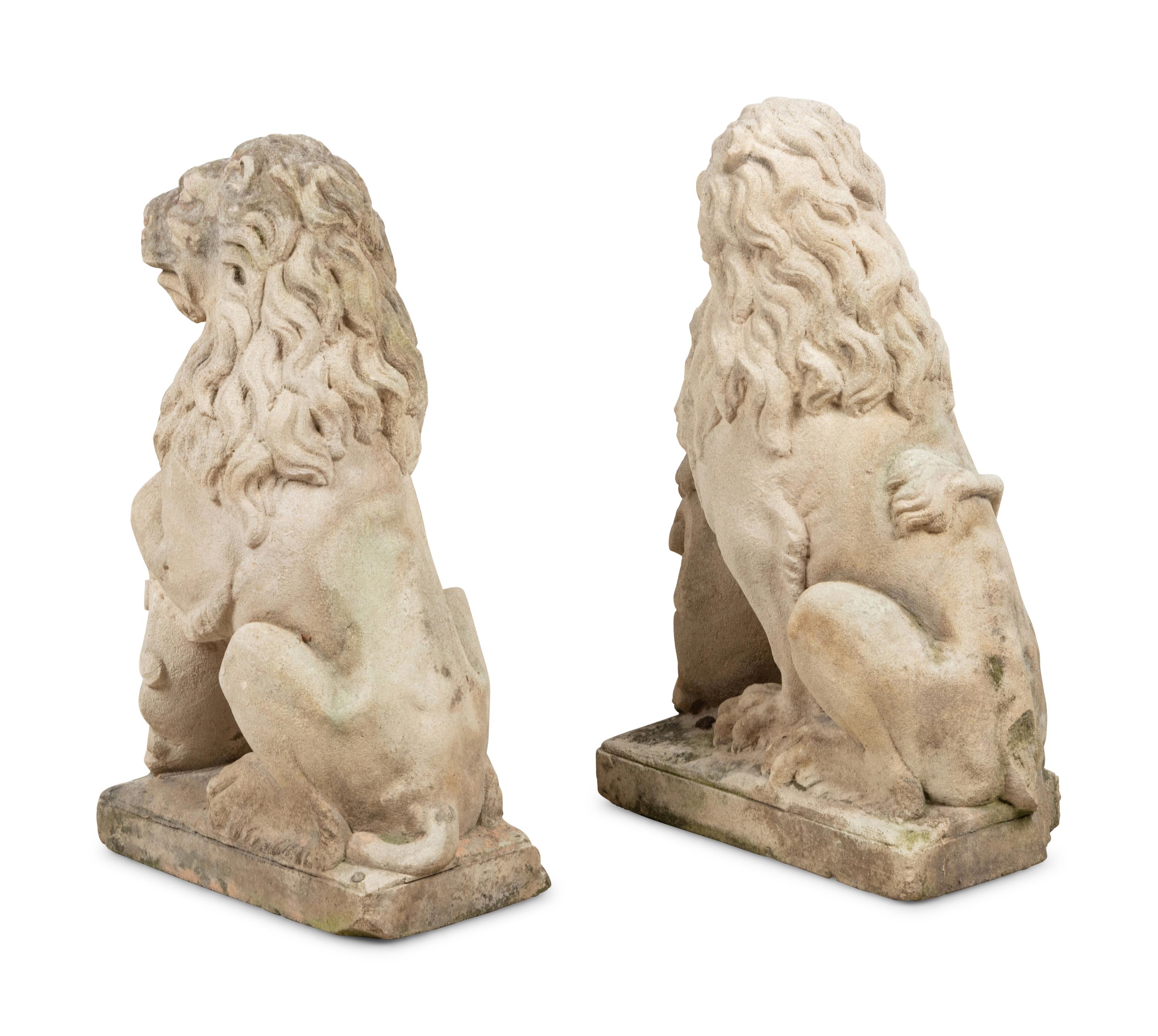 A Pair of Cast Stone Model Lions