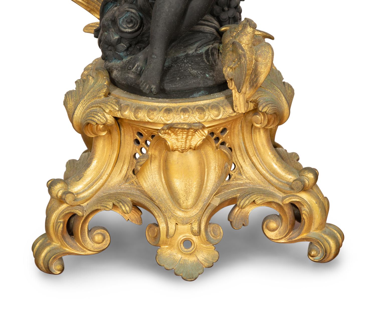 A Pair of Louis XV Style Gilt and Patinated Bronze Figural Six-Light Candelabra