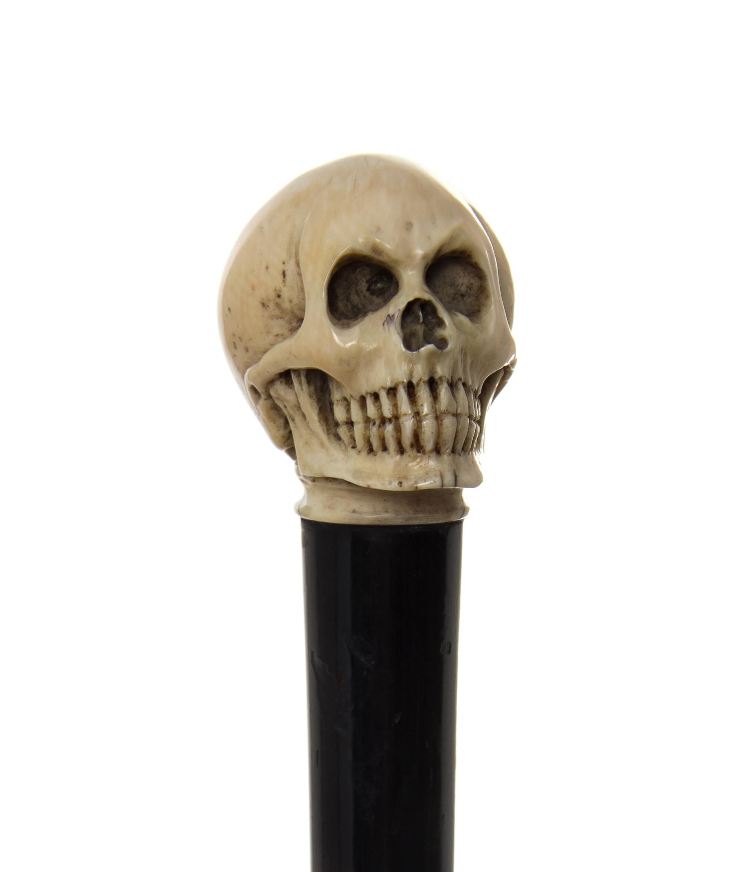 An English Silver and Ivory Handled Walking Stick, JH, London, 1922, Diameter of handle 1 1/2 x length overall 33 1/2 inches.
