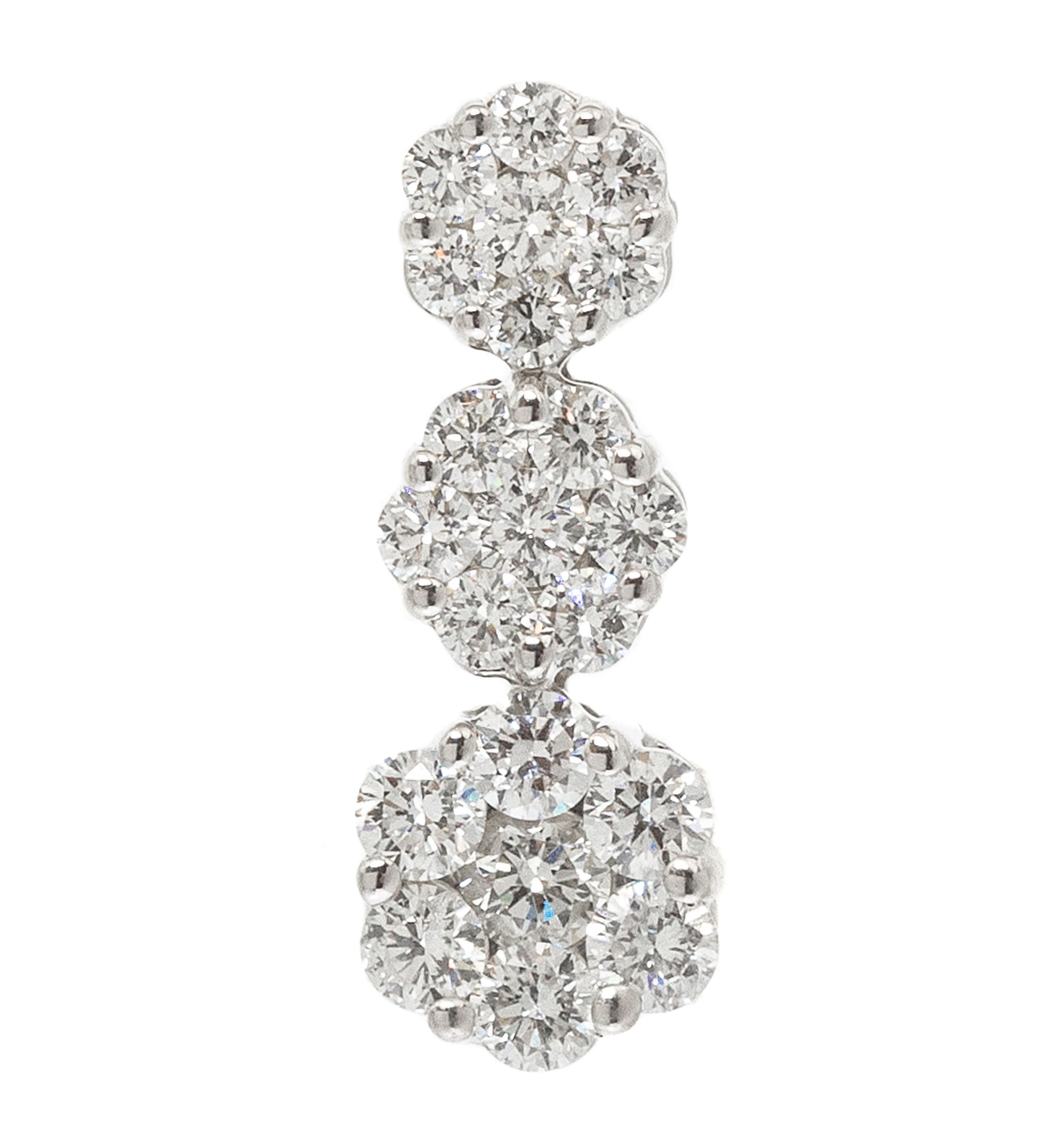 A White Gold and Diamond Cluster Pendant, 1.00 dwts.