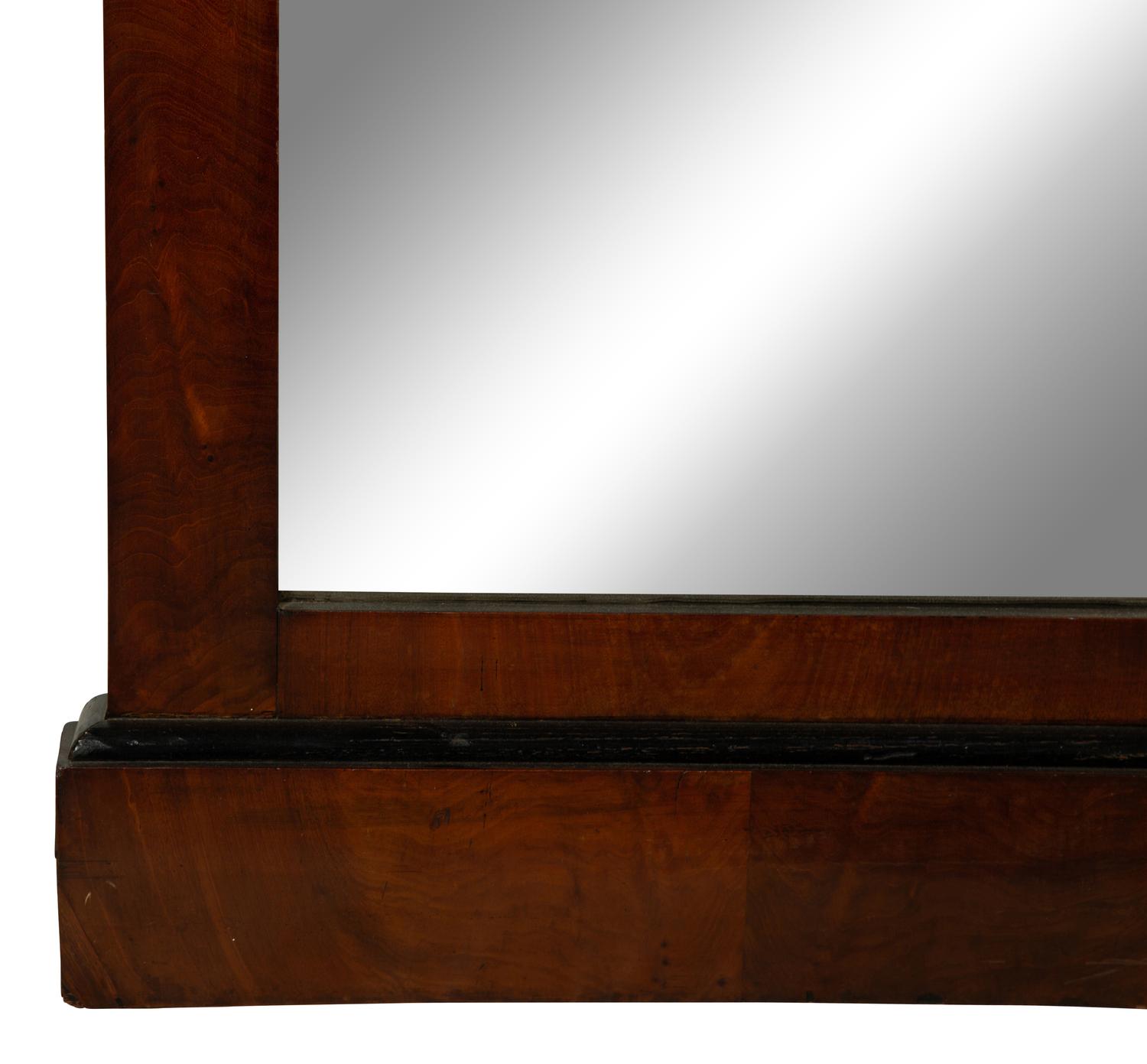 An Austrian Neoclassical Parcel Gilt and Ebonized Walnut Mirror