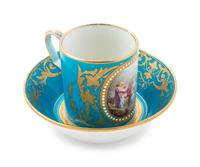 A Sèvres Style Painted, Parcel Gilt and "Jeweled" Turquoise-Ground Porcelain Cup and Saucer
