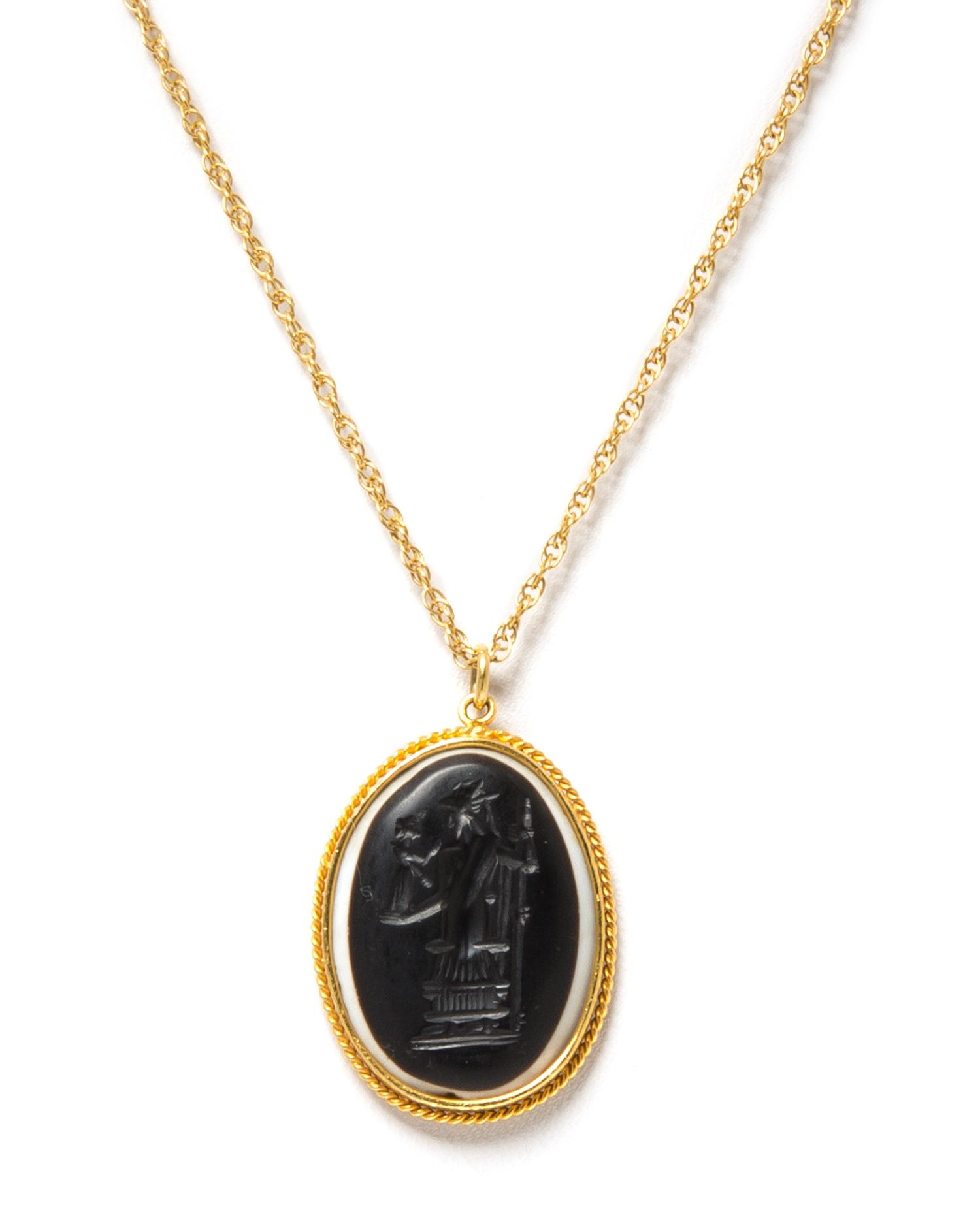 A Yellow Gold and Banded Onyx Intaglio Pendant Necklace, 4.10 dwts.