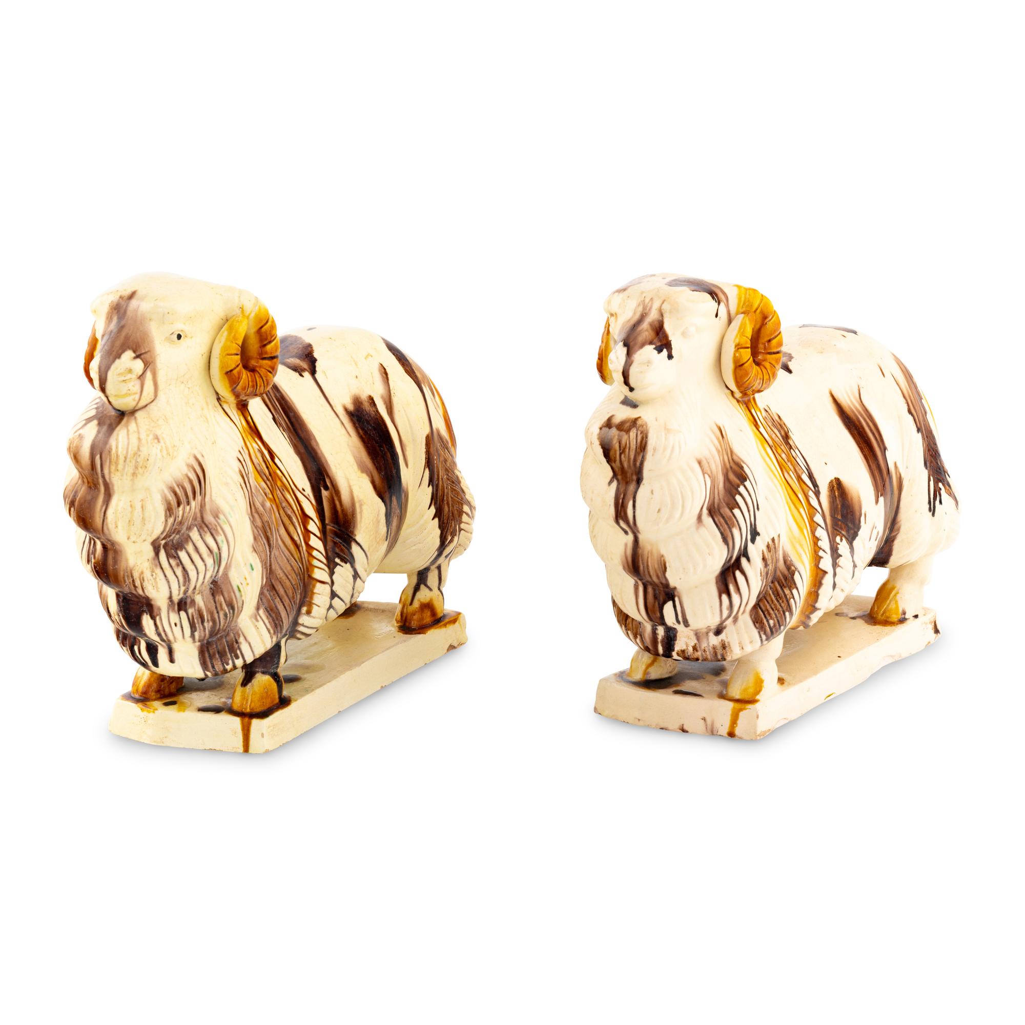 A Pair of Staffordshire Pottery Ram Figures