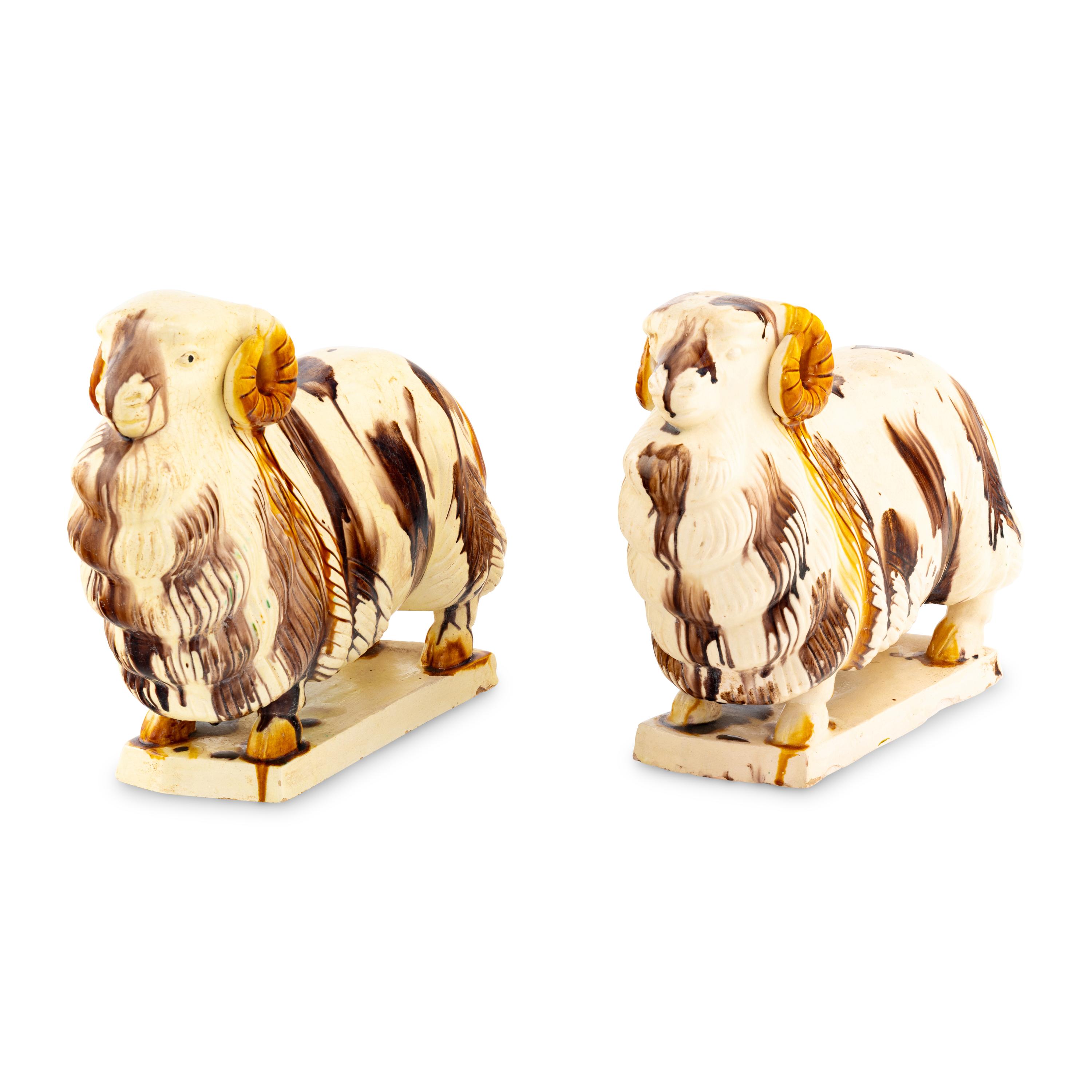 A Pair of Staffordshire Pottery Ram Figures