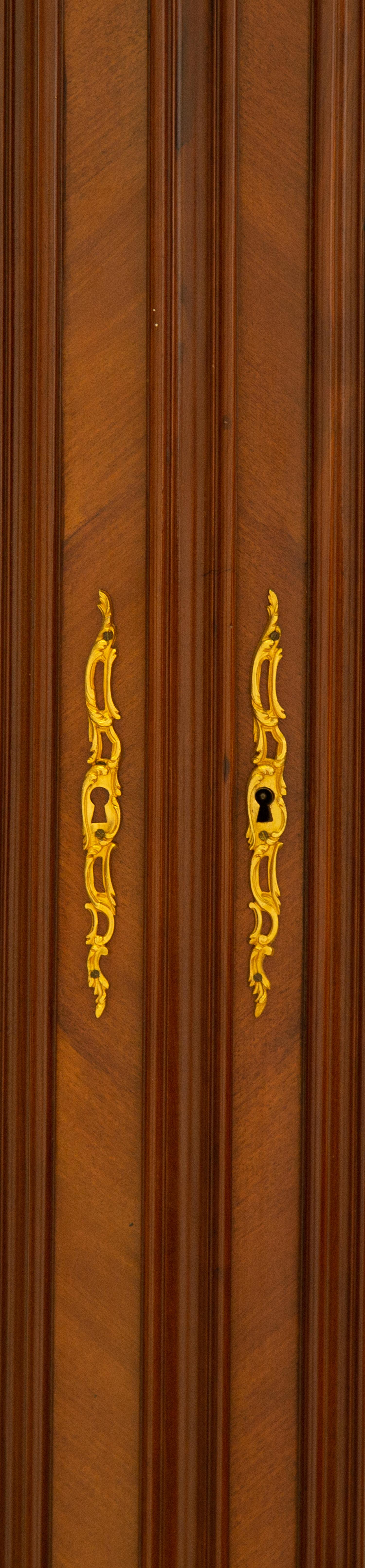 A Louis XV Style Gilt Bronze Mounted Mahogany Vitrine Cabinet