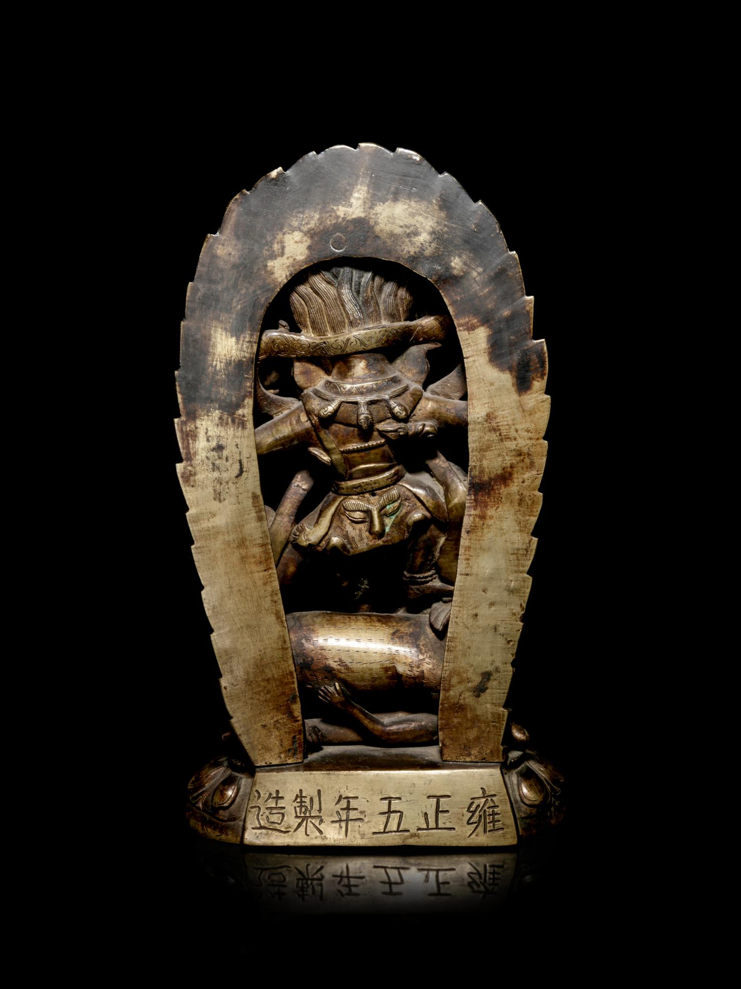 A Tibetan Gilt Bronze Figure of Mahakala and Consort