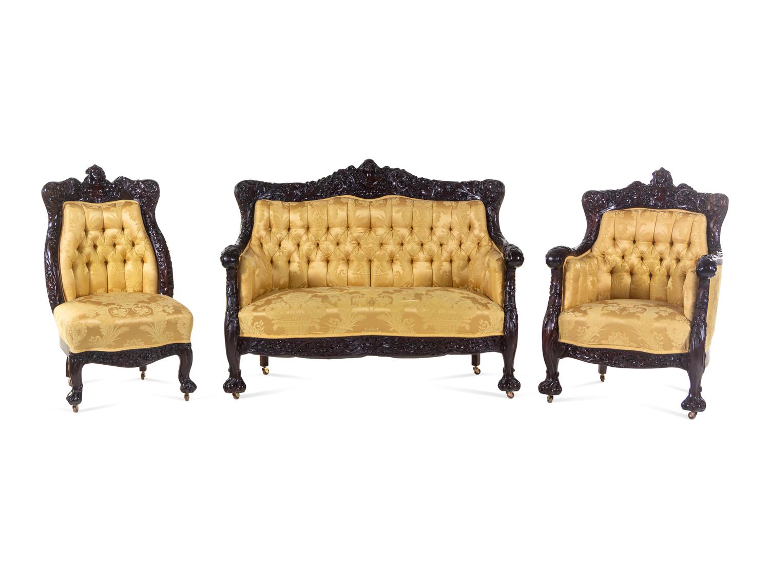 A Karpen Carved Mahogany Three-Piece Parlor Suite