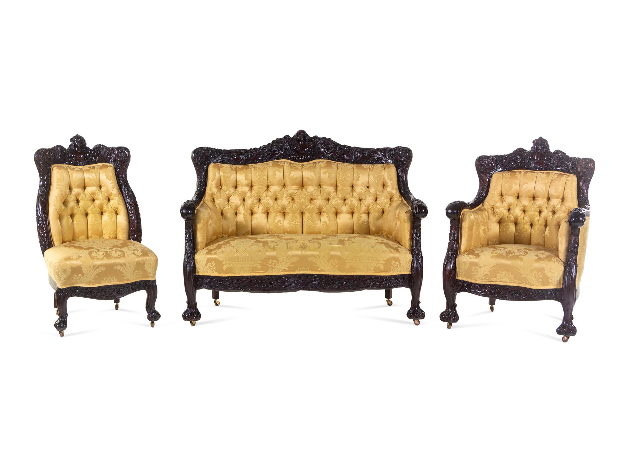 A Karpen Carved Mahogany Three-Piece Parlor Suite