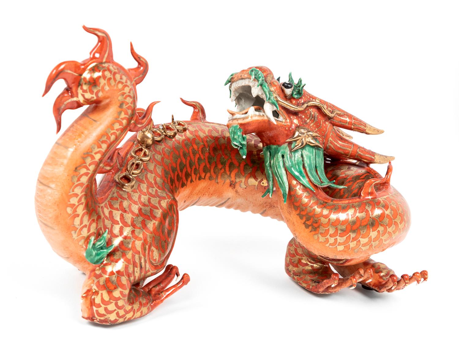 A Chinese Coral Red Ground Gilt and Green Enameled Porcelain Figure of Dragon