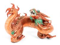 A Chinese Coral Red Ground Gilt and Green Enameled Porcelain Figure of Dragon