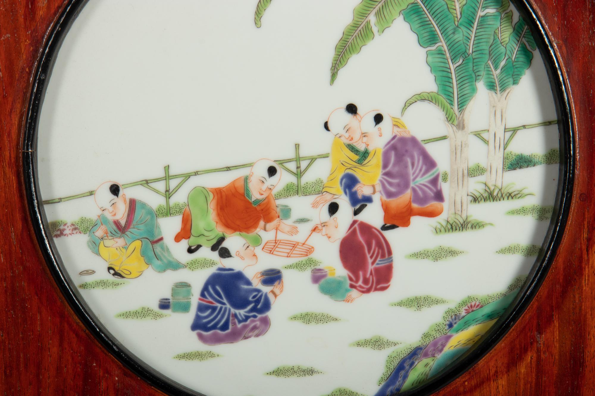 A Set of Four Chinese Famille Rose Porcelain Inset Hardwood Wall Panels