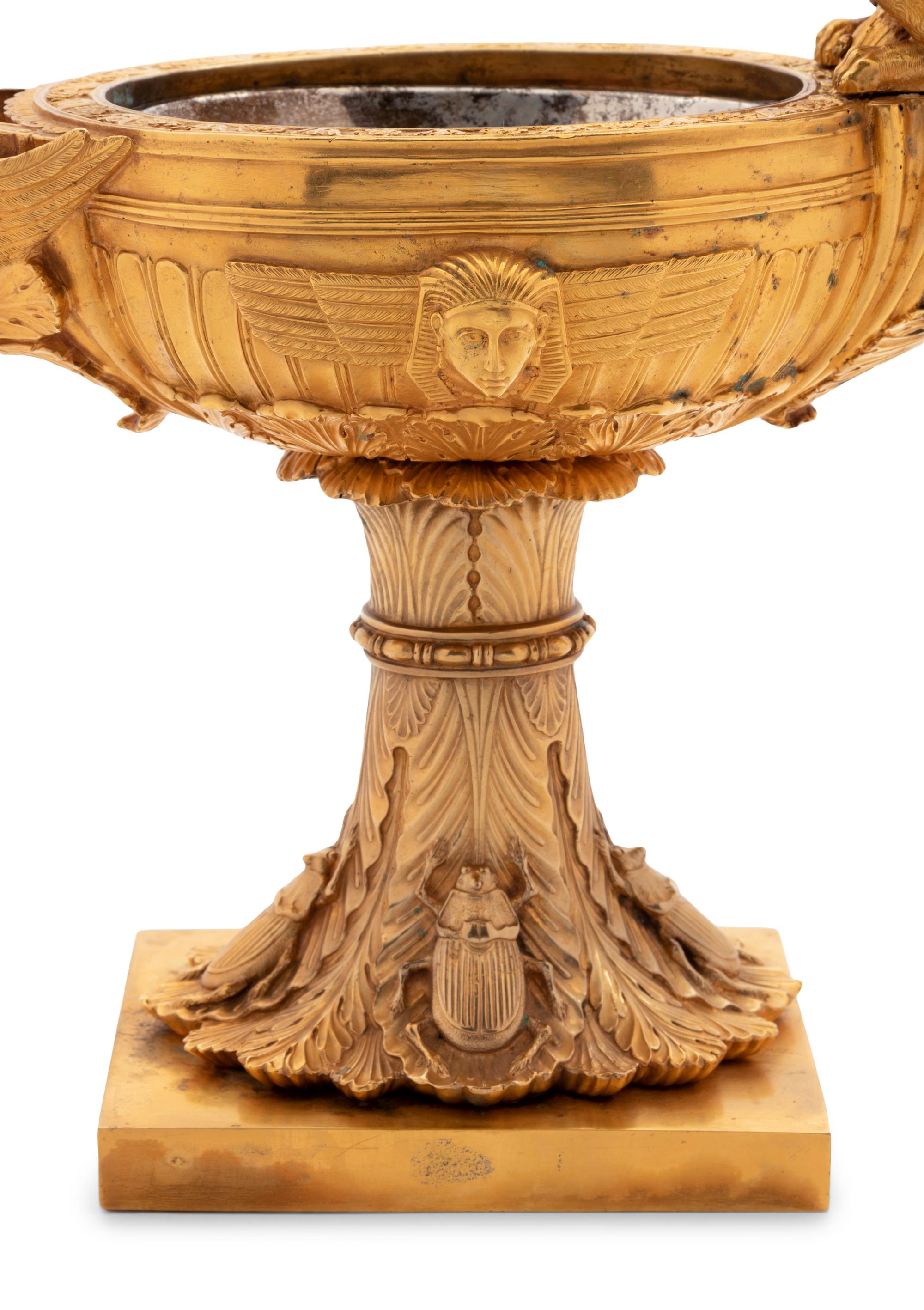 A Continental Gilt Bronze Oil Lamp with a Dragon Handle