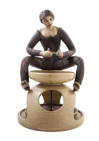 Guy Sydenham, (British, 1916-2005), A Poole Potter Seated at a Wheel, c. 1970