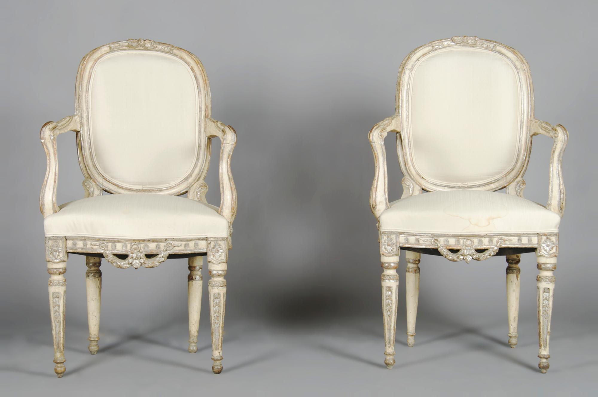 A Pair of Louis XV Style Painted and Parcel Silvered Fauteuil, Height 37 inches.