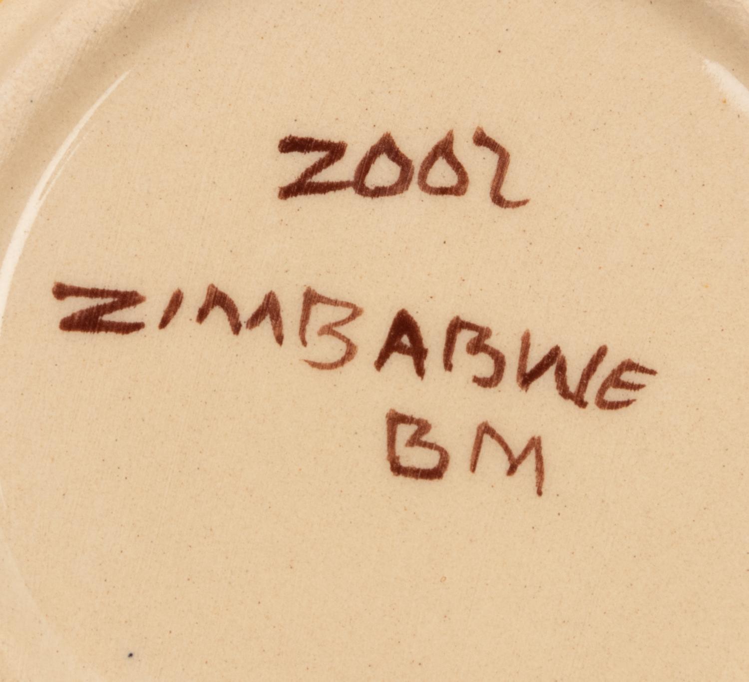 An African Hand-Painted Ceramic Dinner Service
