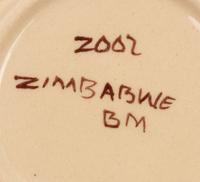 An African Hand-Painted Ceramic Dinner Service