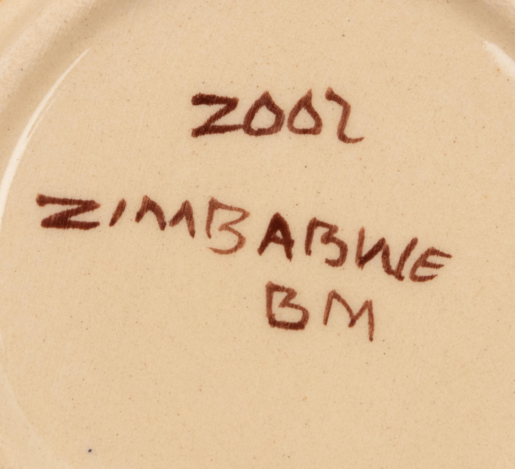 An African Hand-Painted Ceramic Dinner Service