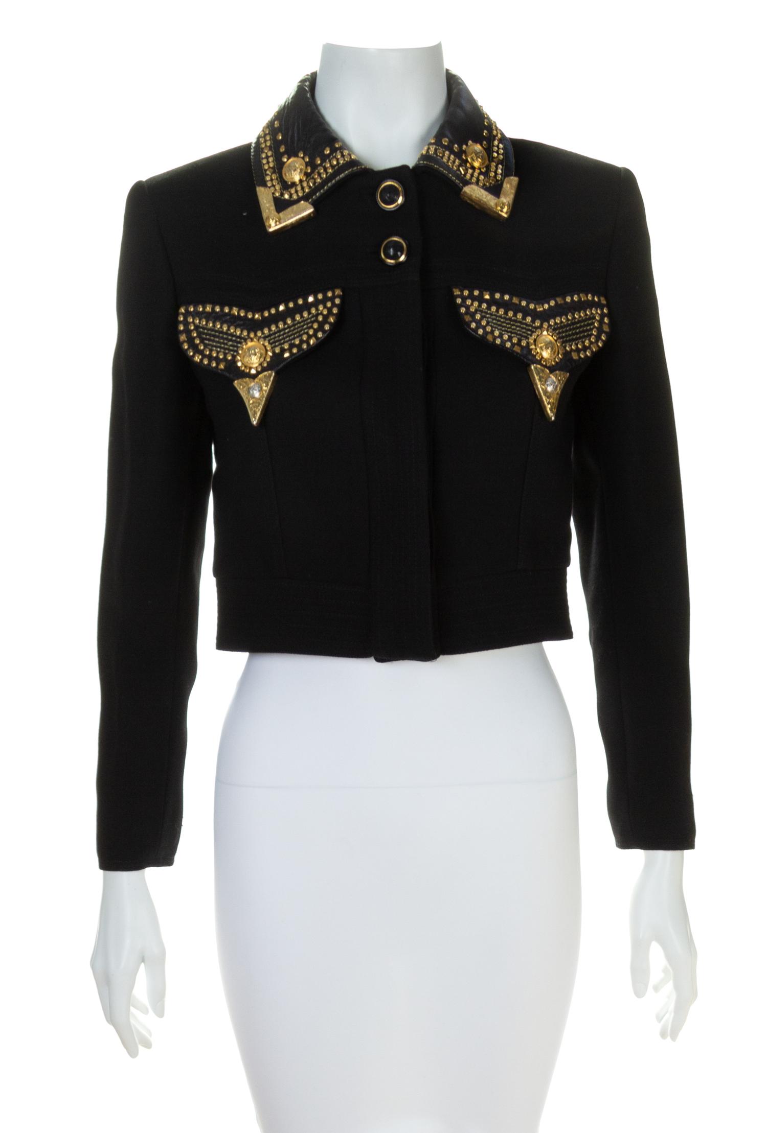 A Gianni Versace Black Cropped Jacket with Grommet Detail, Size 38.