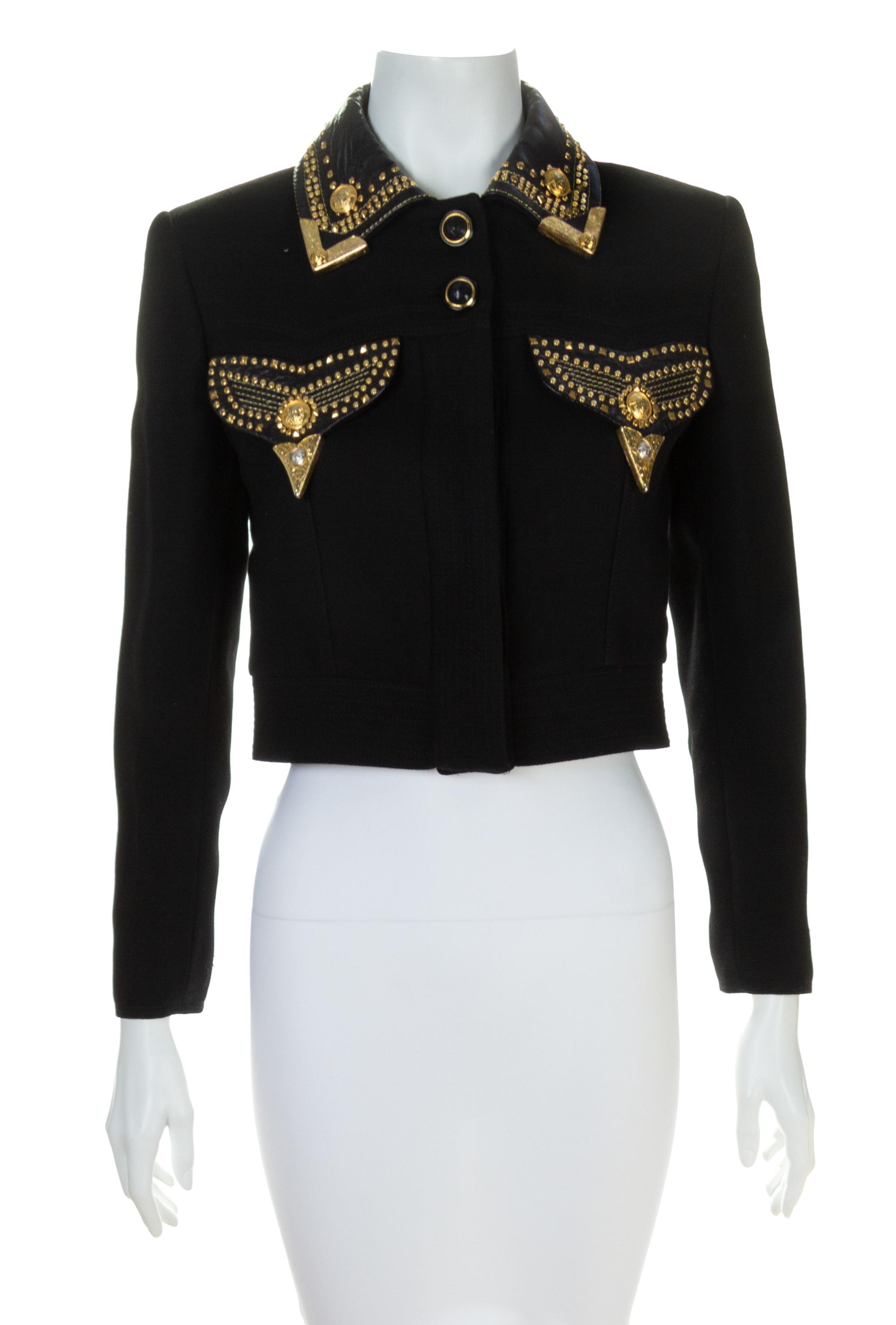 A Gianni Versace Black Cropped Jacket with Grommet Detail, Size 38.