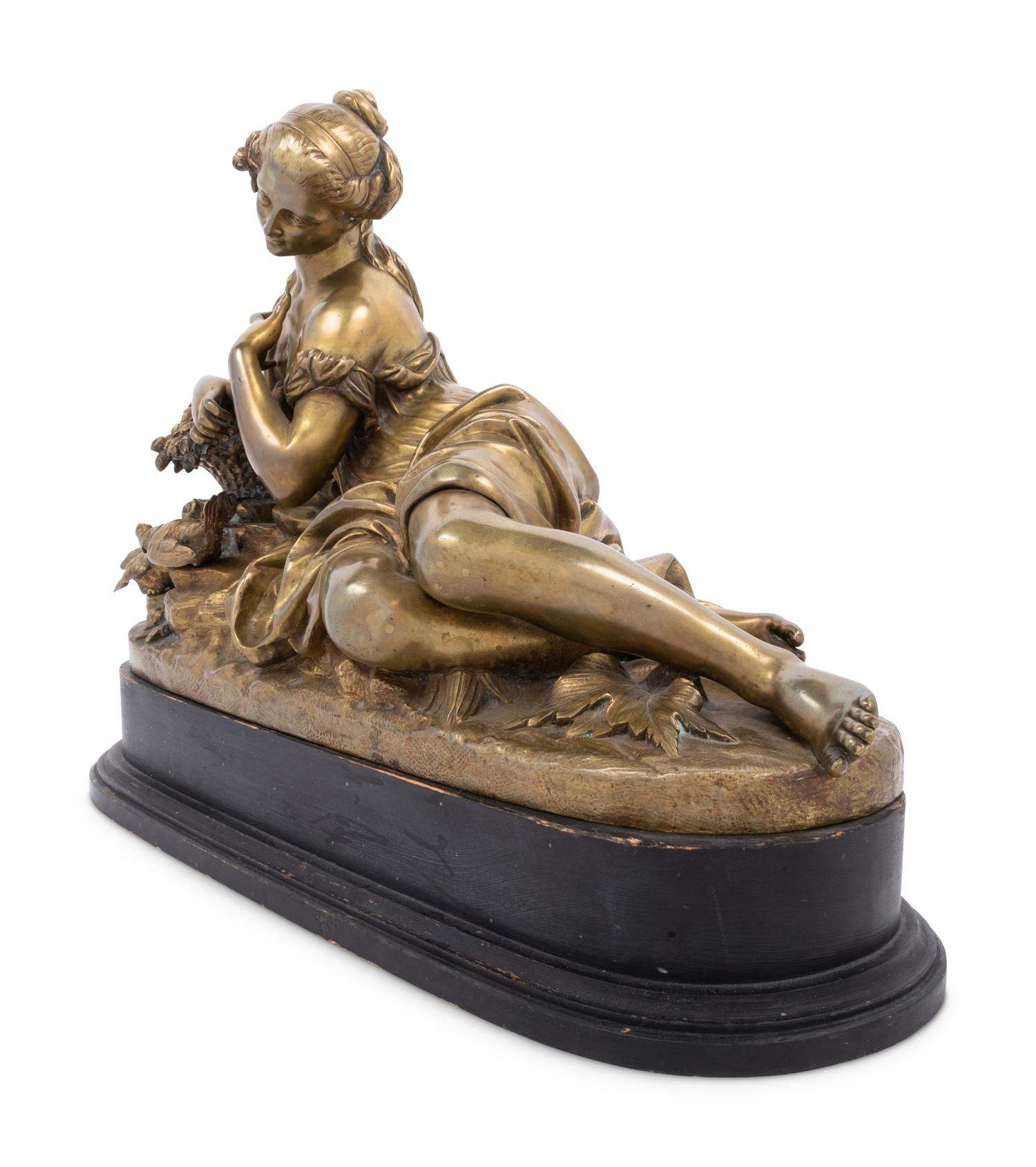A Gilt Bronze Figure of a Reclining Woman