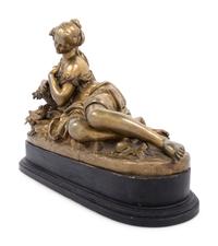 A Gilt Bronze Figure of a Reclining Woman