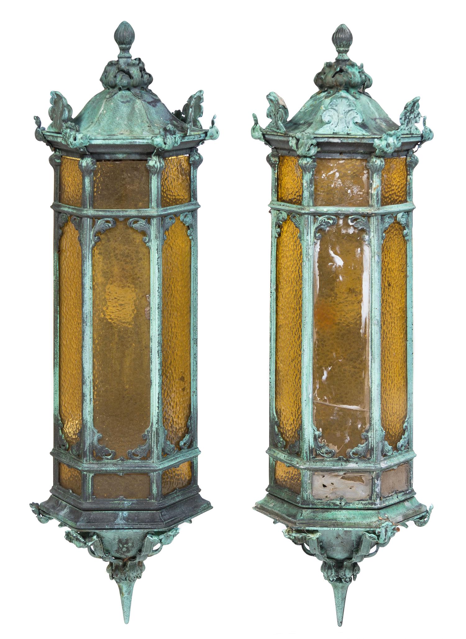 A Pair of Patinated Cast Metal Lanterns Height 35 inches.