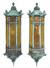 A Pair of Patinated Cast Metal Lanterns Height 35 inches.