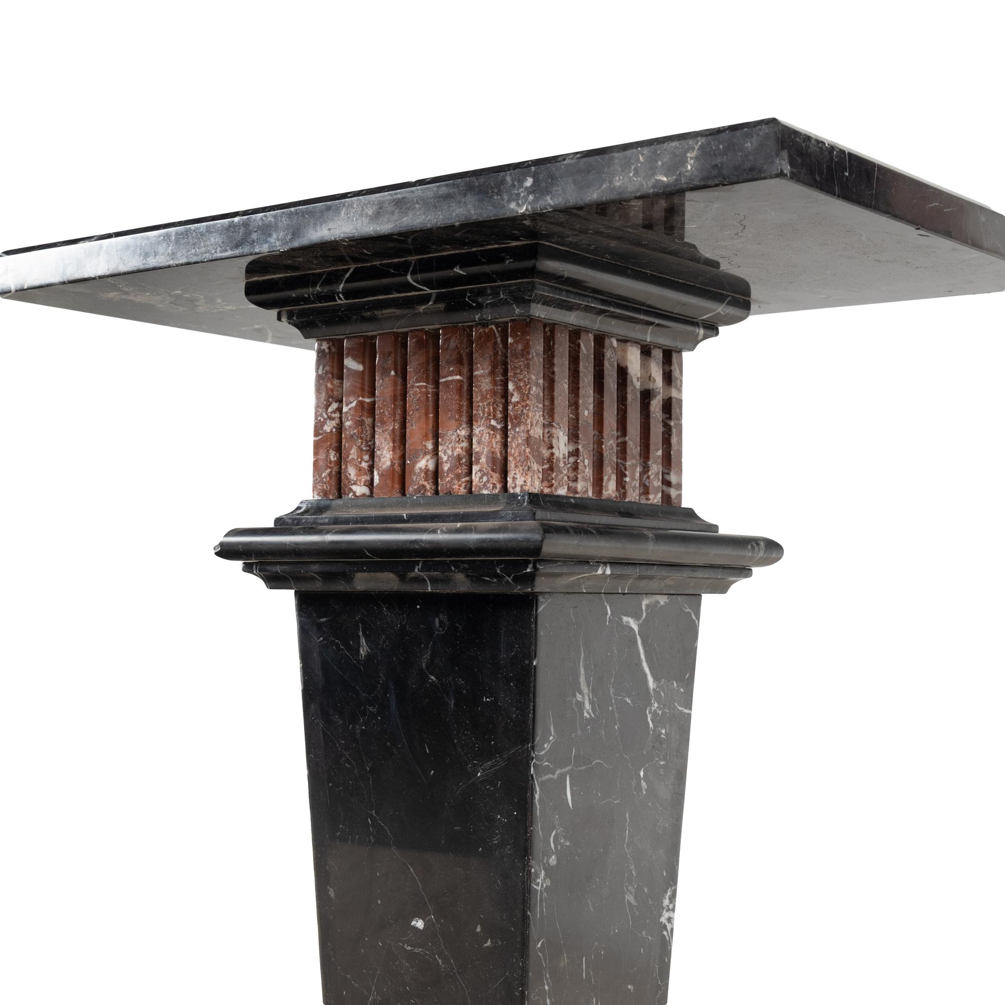 A Nero Marquina and Rosso Francia Marble Pedestal