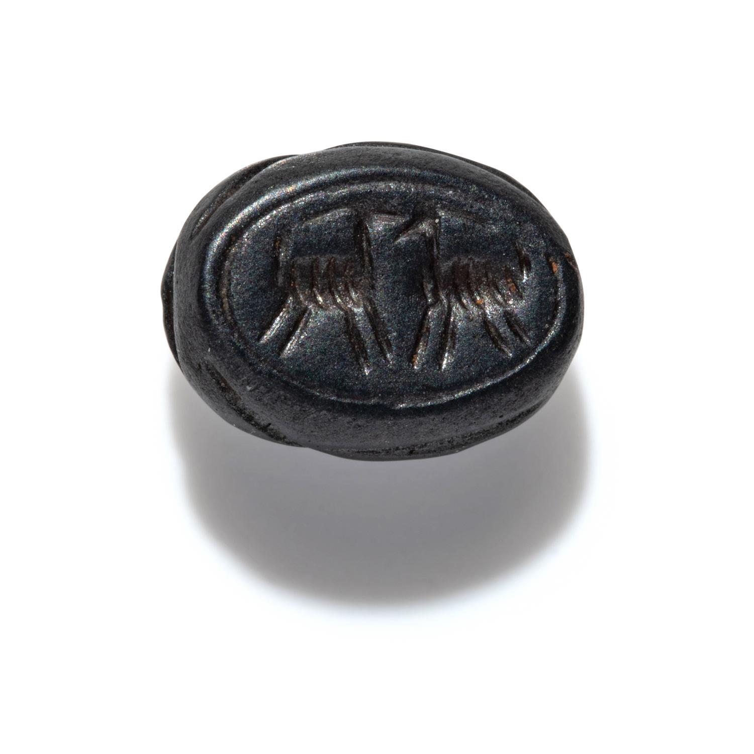 A Phoenician Hematite Scarab with Two Ibexes