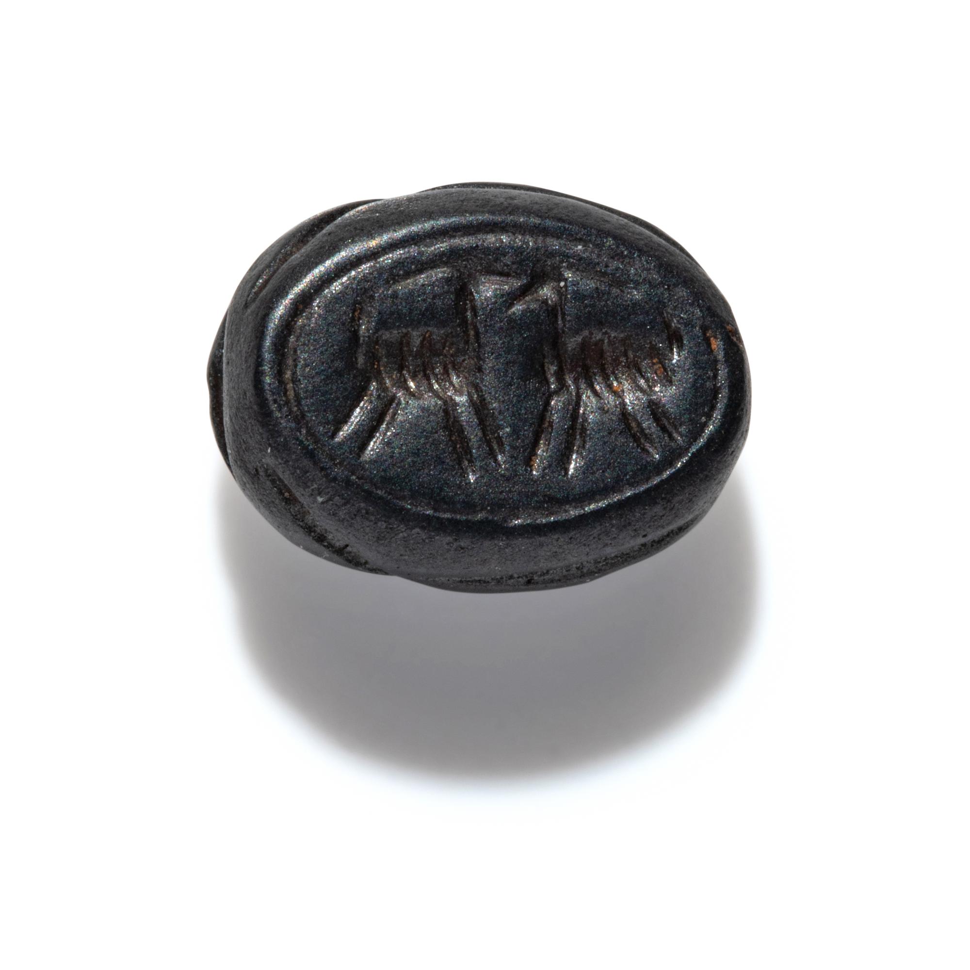 A Phoenician Hematite Scarab with Two Ibexes