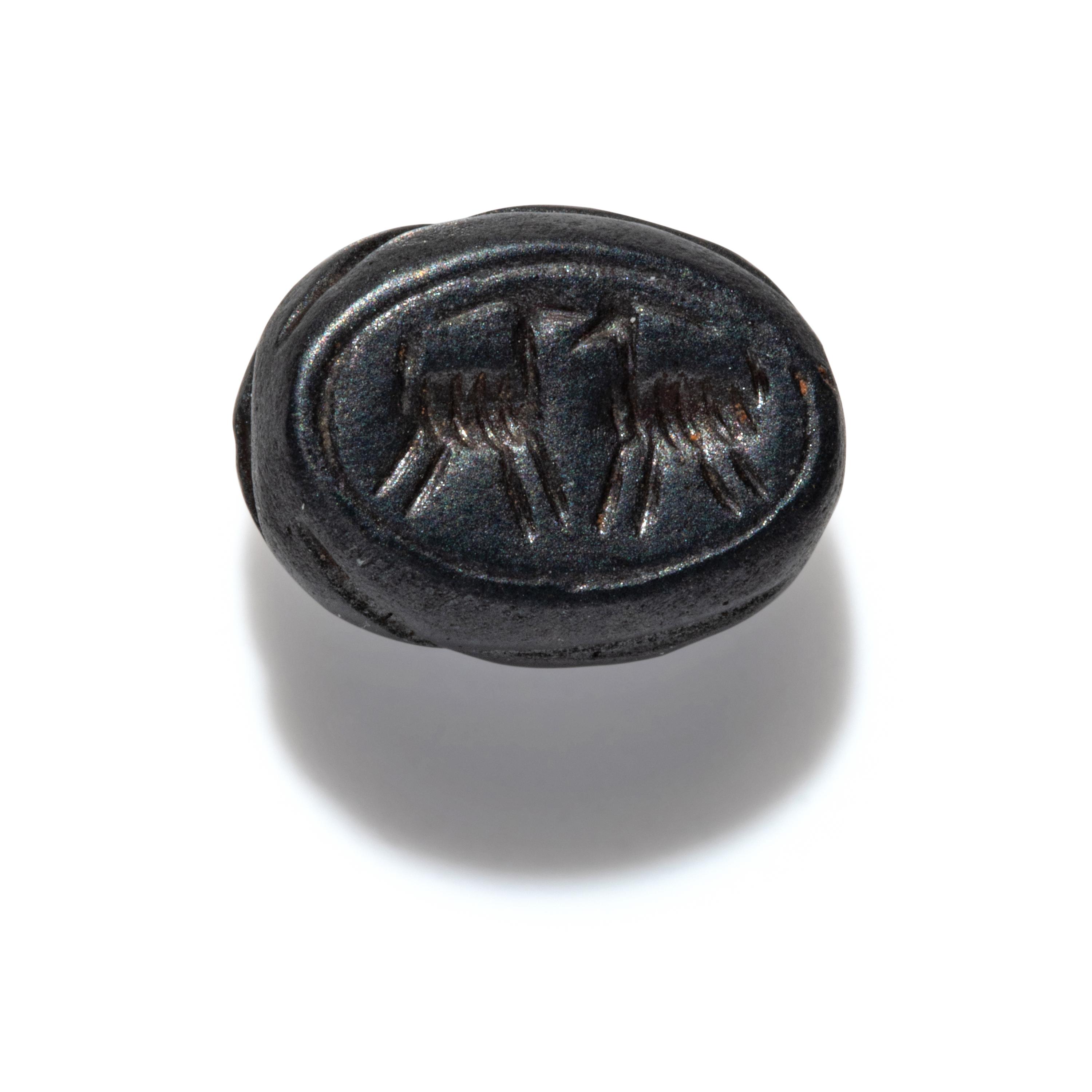 A Phoenician Hematite Scarab with Two Ibexes