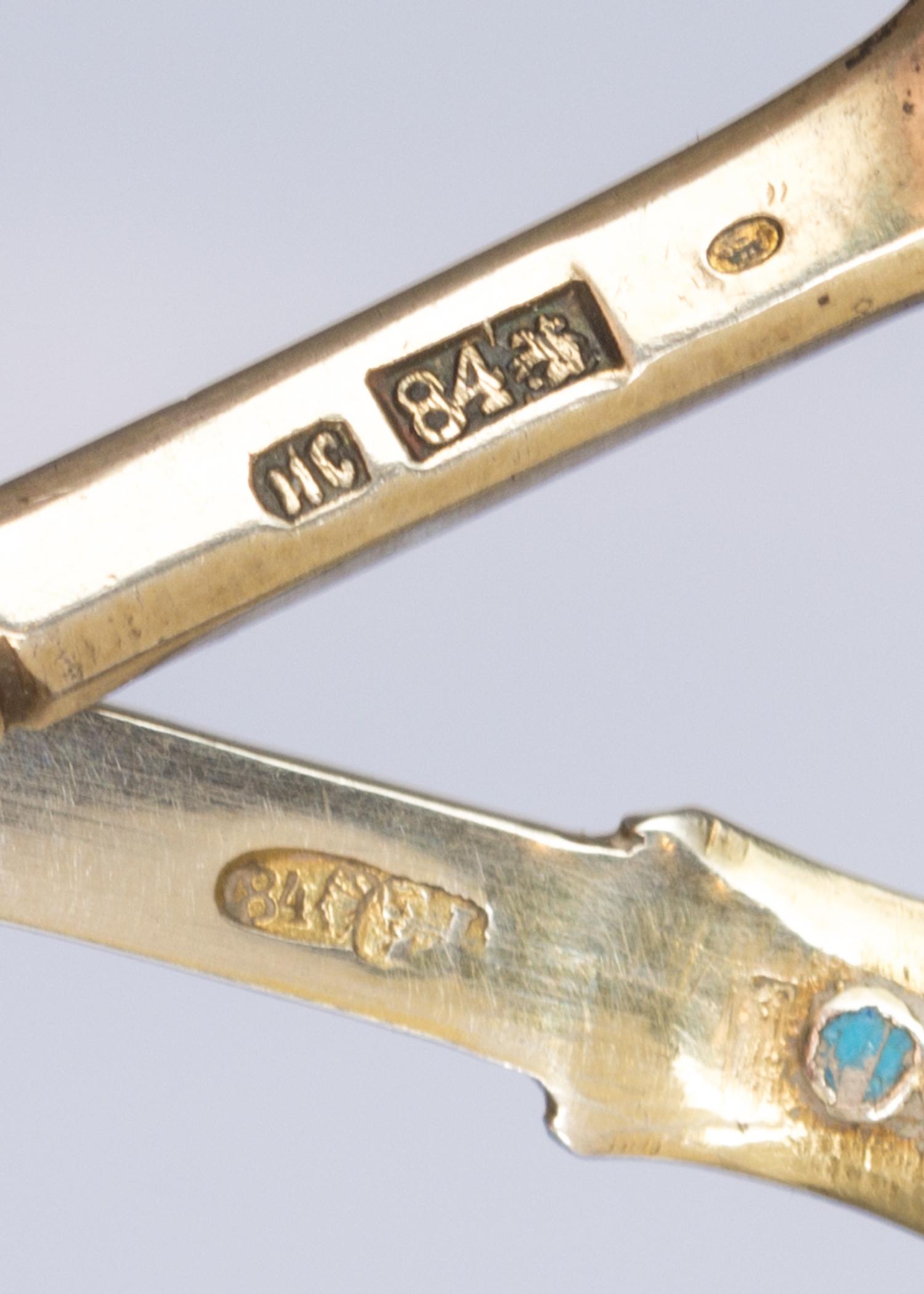 Two Russian Silver-Gilt and Enamel Tea Scoops, One with mark of Ivan Saltykov, Moscow, 19th century, each with polychrome enamels.