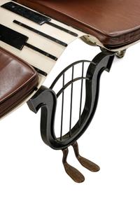 A Postmodernist Painted Iron Piano Motif Bench