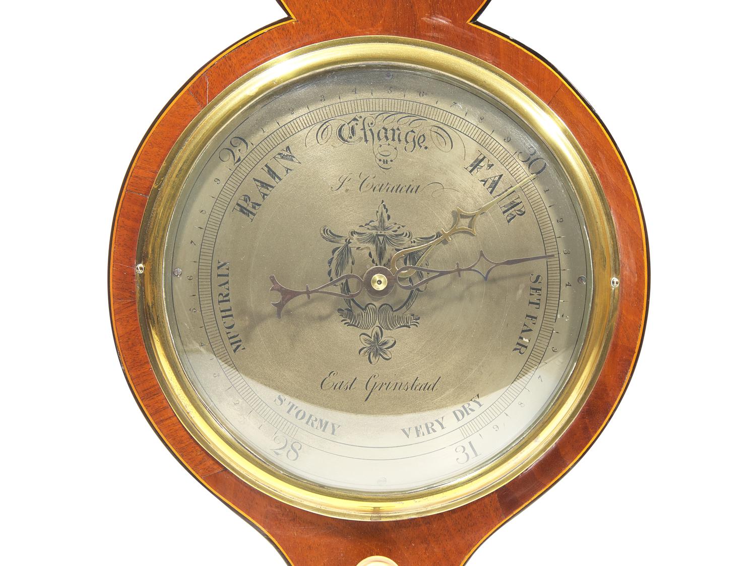A Regency Brass Mounted and Banded Mahogany Wheel Barometer