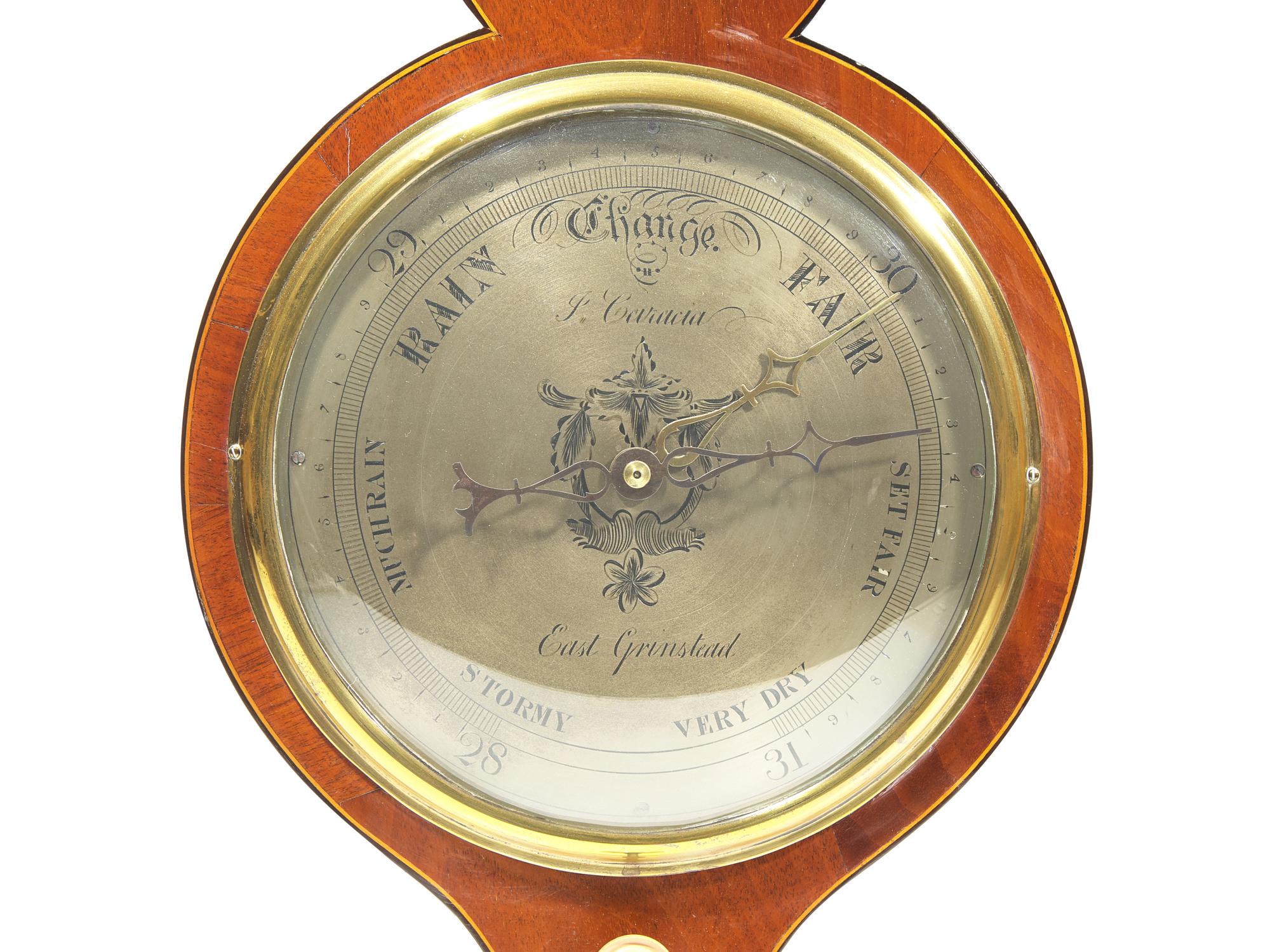 A Regency Brass Mounted and Banded Mahogany Wheel Barometer