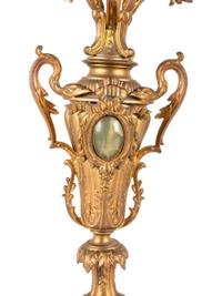 A Neoclassical Gilt Metal and Onyx Clock Garniture