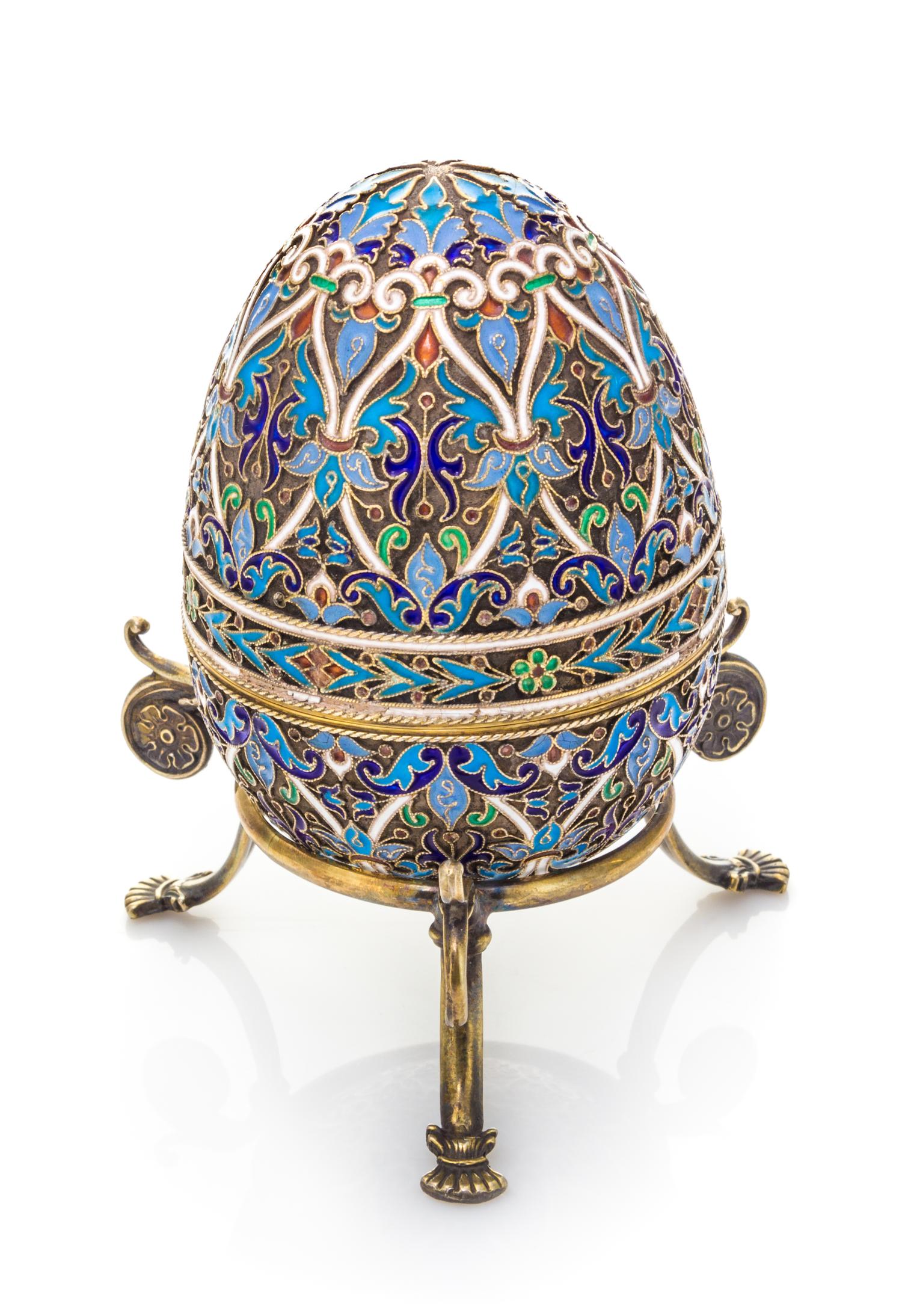 A Russian Enameled Silver Egg, Mark of Ivan Khlebnikov with Imperial Warrant, Moscow, Late 19th/Early 20th Century, the case worked to