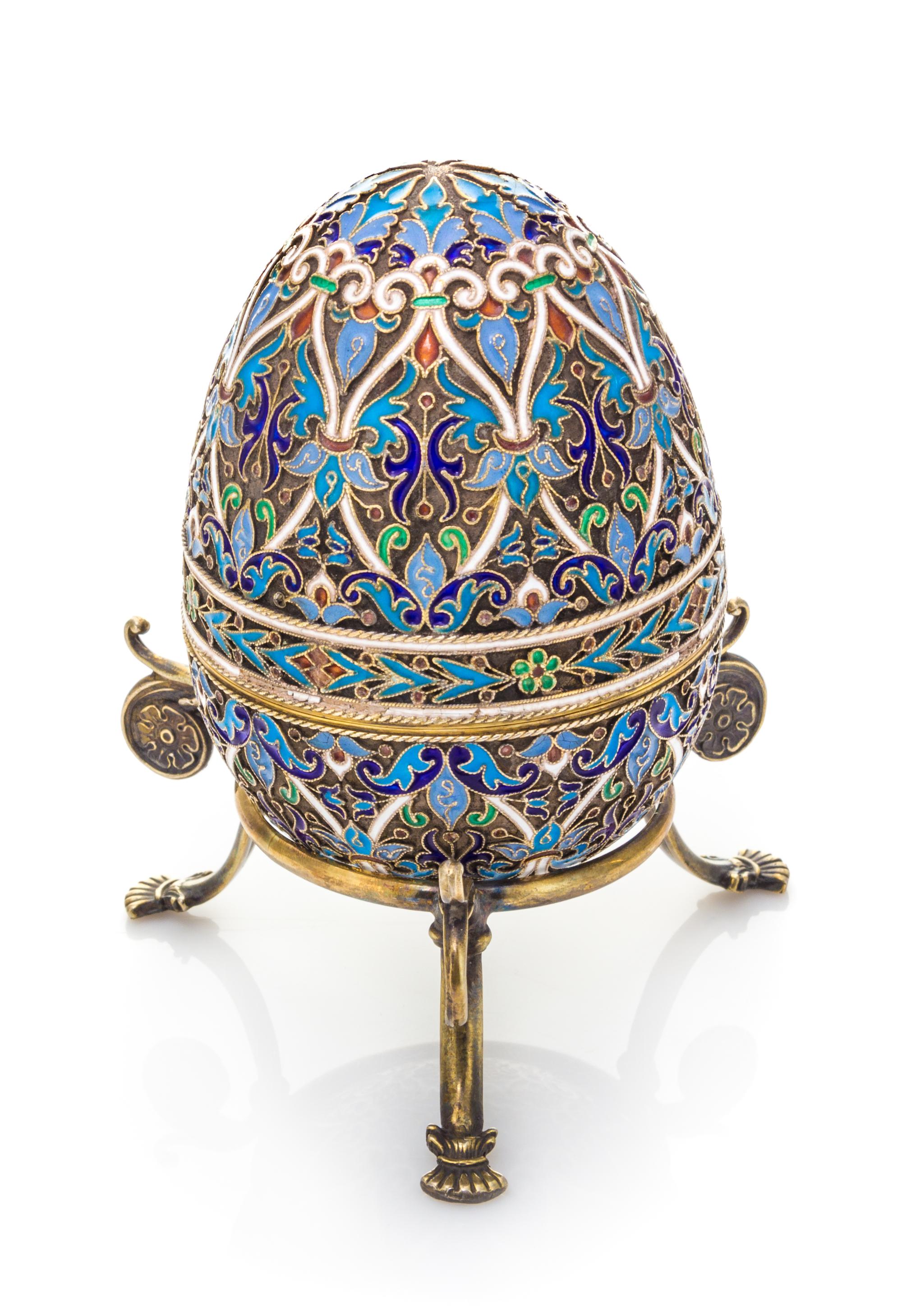 A Russian Enameled Silver Egg, Mark of Ivan Khlebnikov with Imperial Warrant, Moscow, Late 19th/Early 20th Century, the case worked to