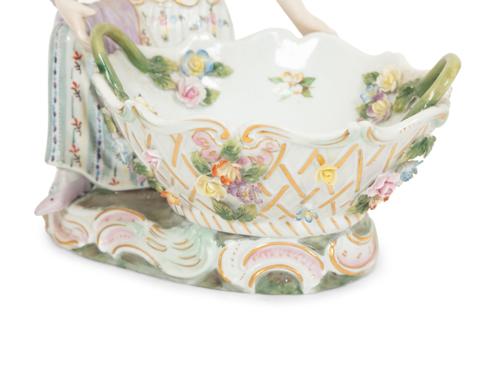 A Pair of Dresden Porcelain Figural Sweetmeat Dishes