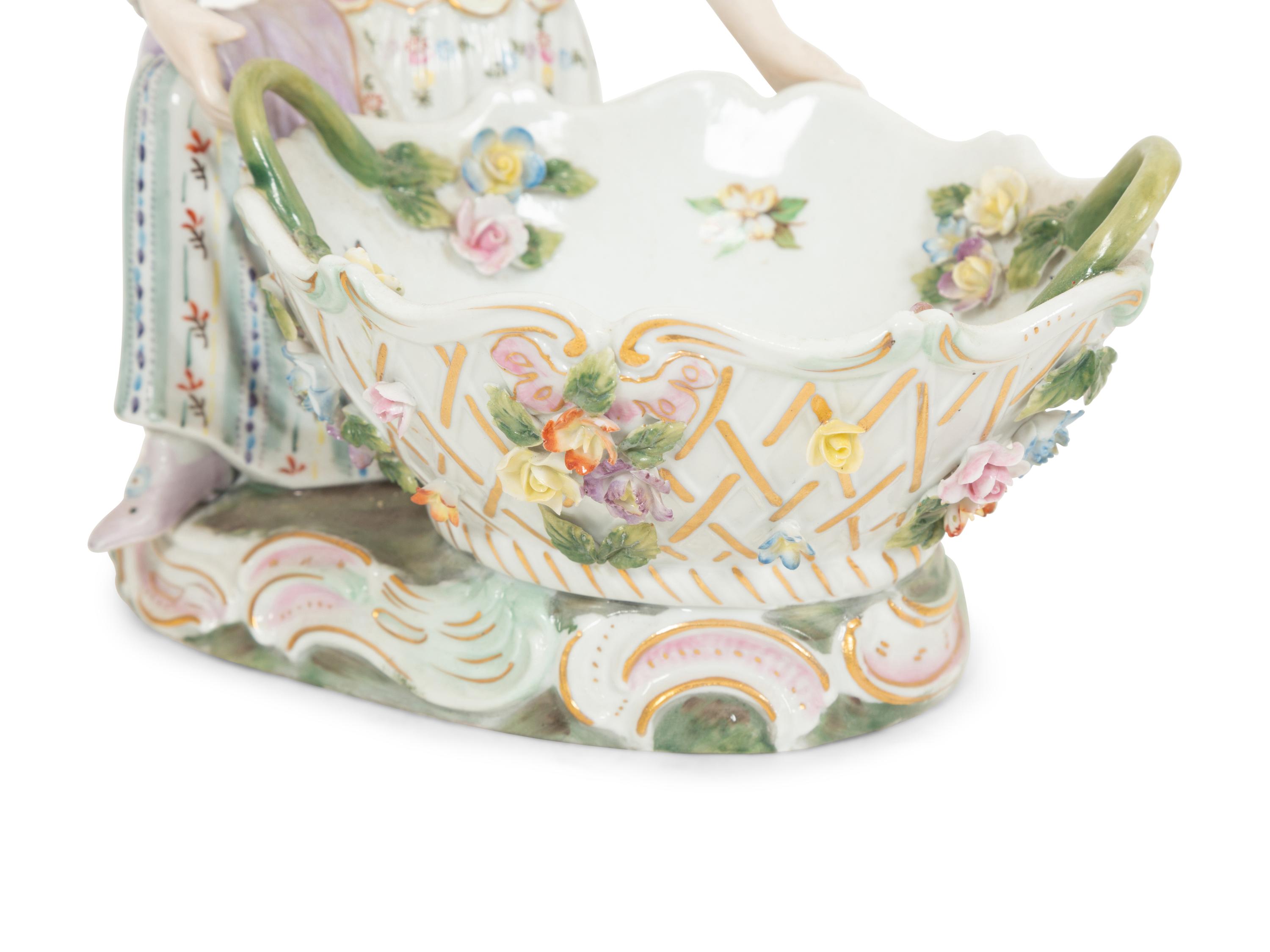 A Pair of Dresden Porcelain Figural Sweetmeat Dishes
